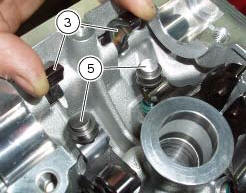 Refitting the opening shims and opening rocker arms